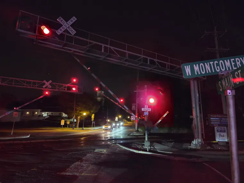 Cars wait on Main Street for the SEPTA rail crossing signals to rise in downtown North Wales on Tuesday night, Oct. 14, 2025