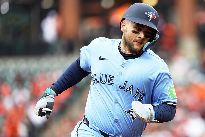 Apr 12, 2025; Baltimore, Maryland, USA; Toronto Blue Jays shortstop Bo Bichette (11) scores a run during the first inning against the Baltimore Orioles at Oriole Park at Camden Yards. Mandatory Credit: Daniel Kucin Jr.-Imagn Images