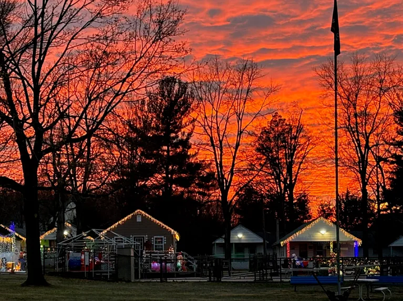Visitors walk along a festive 2024 Holiday Lane in which the exterior of Variety’s rustic cabins were lit up with holiday lights and decorated in holiday themes by local community groups. (Photo courtesy of Variety Club)
