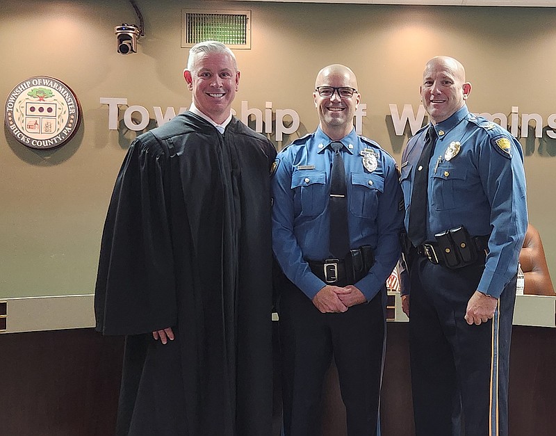 Pictured with Sgt. Outland (center) are Hon. Christoper E. O’Neill, Magisterial Judge, Bucks County, and Chief James Donnelly III. (Submitted photo)