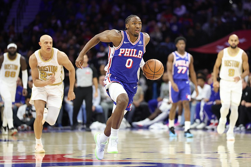 Nov 11, 2025; Philadelphia, Pennsylvania, USA; Philadelphia 76ers guard Tyrese Maxey (0) dribbles up court past the Boston Celtics during the third quarter at Xfinity Mobile Arena. Mandatory Credit: Bill Streicher-Imagn Images