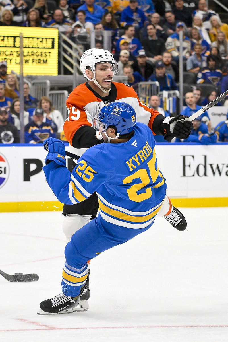 Nov 14, 2025; St. Louis, Missouri, USA; Philadelphia Flyers right wing Garnet Hathaway (19) checks St. Louis Blues right wing Jordan Kyrou (25) during the second period at Enterprise Center. Mandatory Credit: Jeff Curry-Imagn Images