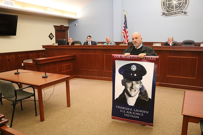 Mayor Leonard Desiderio unveils a sample of a Hometown Heroes banner during the Nov. 12 City Council meeting.
