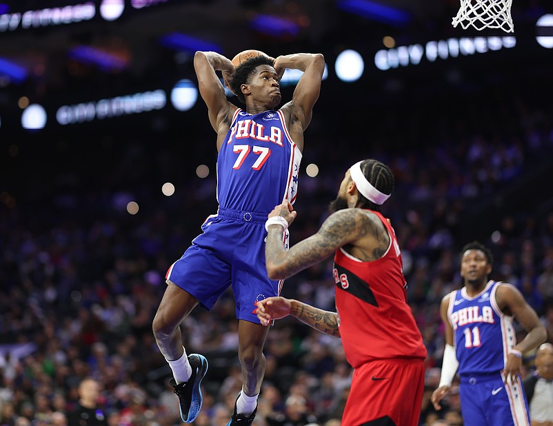 Nov 19, 2025; Philadelphia, Pennsylvania, USA; Philadelphia 76ers guard VJ Edgecombe (77) drives for a dunk in front of Toronto Raptors forward Brandon Ingram (3) during the second quarter at Xfinity Mobile Arena. Mandatory Credit: Bill Streicher-Imagn Images