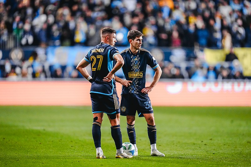 Union defender Kai Wagner, left, and midfielder Milan Iloski stand over a free kick in Sunday's Eastern Conference semifinal against New York City FC.