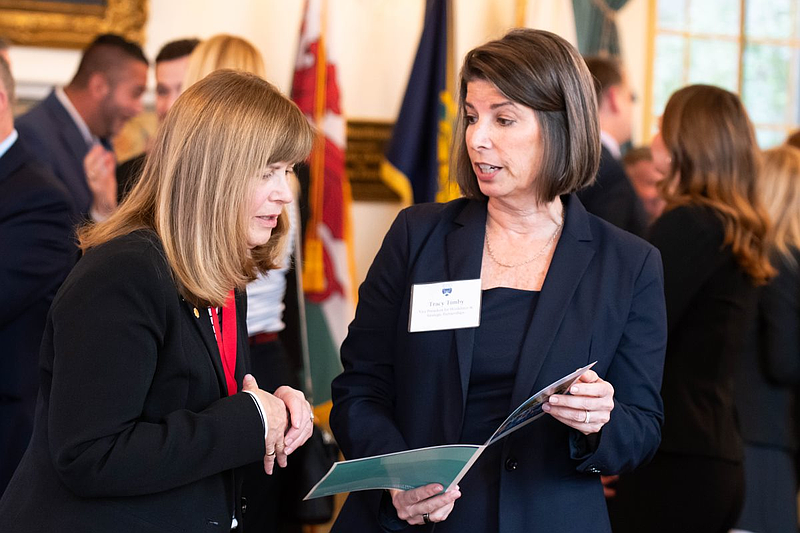Tracy Timby, Vice President of Workforce and Strategic Partnerships at Bucks County Community College, discusses a new international transfer agreement with Wrexham University in Wales with Mary Glassman Jones of the Welsh Society of Philadelphia. Credit: Eric Parker/Bucks County Community College