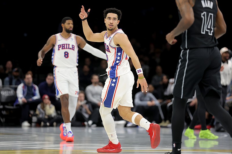 Nov 28, 2025; Brooklyn, New York, USA; Philadelphia 76ers guard Jared McCain (20) celebrates his three point shot against the Brooklyn Nets during the second quarter at Barclays Center. Mandatory Credit: Brad Penner-Imagn Images