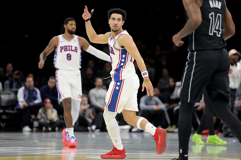 Nov 28, 2025; Brooklyn, New York, USA; Philadelphia 76ers guard Jared McCain (20) celebrates his three point shot against the Brooklyn Nets during the second quarter at Barclays Center. Mandatory Credit: Brad Penner-Imagn Images