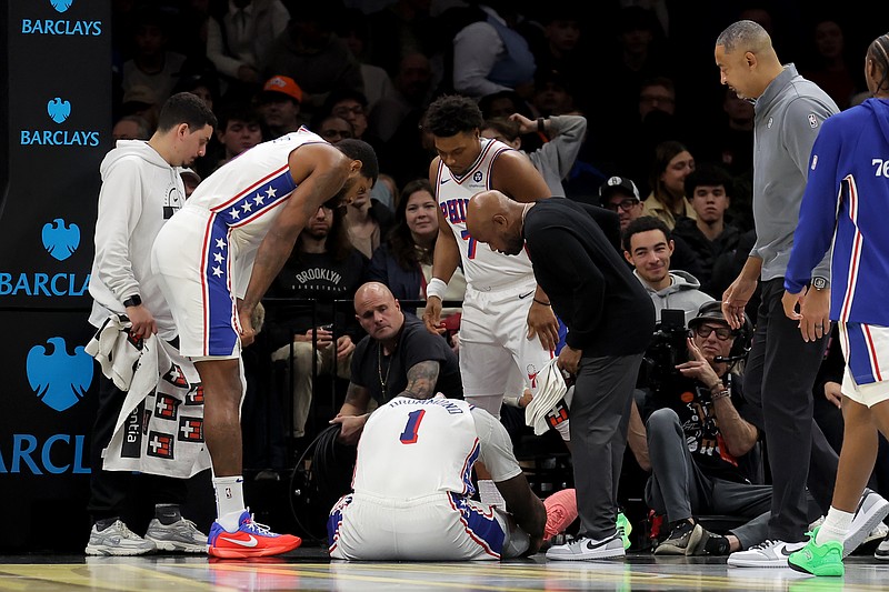 Nov 28, 2025; Brooklyn, New York, USA; Philadelphia 76ers center Andre Drummond (1) is tended to after suffering an injury during the second quarter against the Brooklyn Nets at Barclays Center. Mandatory Credit: Brad Penner-Imagn Images