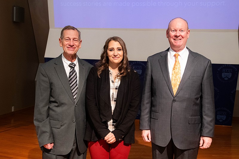 Bucks County Community College student Madison McCrackin (center) recently earned two top scholarships through the Phi Theta Kappa honor society She was congratulated by Dr. Charles Beem (left), the faculty advisor to PTK, and Dr. Patrick Jones, President and CEO of BCCC. (Credit: BCCC)