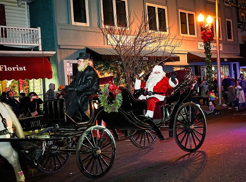 Santa Claus waves to parade spectators from a horse-drawn carriage. (Photo courtesy of Ocean City)