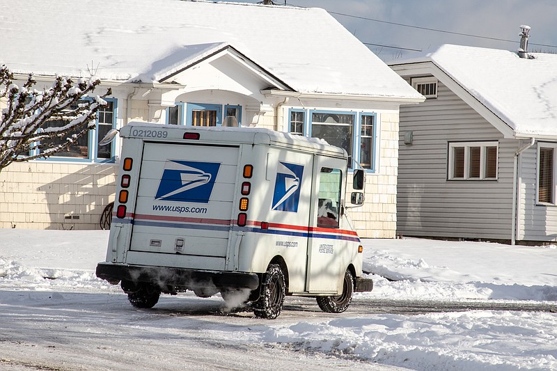 Everett WA. / USA - 02/09/2019: US Postal Service Jeep Delivering Mail During Unusual Winter Snow Storm