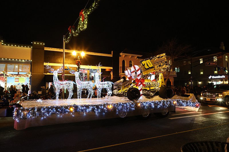 Sparkling holiday floats roll down Asbury Avenue to entertain the spectators. (Photos by Max Kelly)