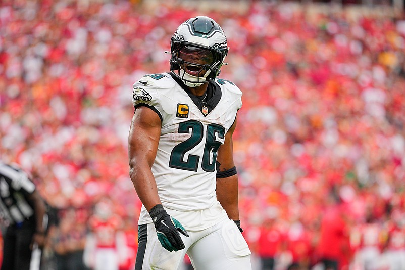 Sep 14, 2025; Kansas City, Missouri, USA; Philadelphia Eagles running back Saquon Barkley (26) celebrates after quarterback Jalen Hurts (not pictured) scored a touchdown  against the Kansas City Chiefs during the fourth quarter of the game at GEHA Field at Arrowhead Stadium. Mandatory Credit: Jay Biggerstaff-Imagn Images