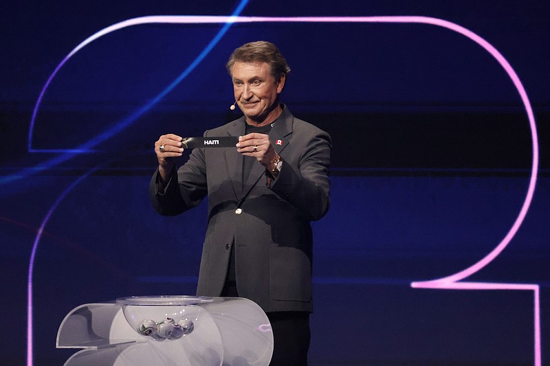 Dec 5, 2025; Washington, District of Columbia, USA; Wayne Gretzky draws the card of Haiti for Group C during the FIFA World Cup 2026 Final Draw at John F. Kennedy Center for the Performing Arts. Mandatory Credit: Amber Searls-Imagn Images
