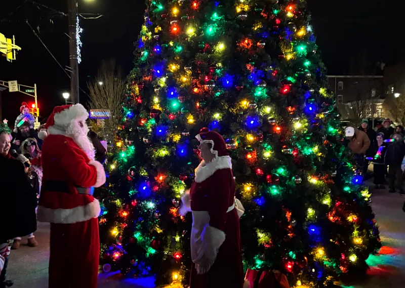 Santa and Mrs. Claus light the Christmas tree at Souderton’s tree lighting ceremony.