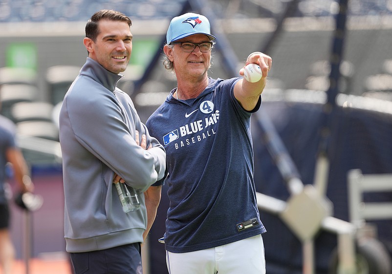 Jun 3, 2025; Toronto, Ontario, CAN;  Philadelphia Phillies Vice President and general manager Preston Mattingly talks with Toronto Blue Jays bench coach Don Mattingly (46) during batting practice before a game at Rogers Centre. Mandatory Credit: Nick Turchiaro-Imagn Images