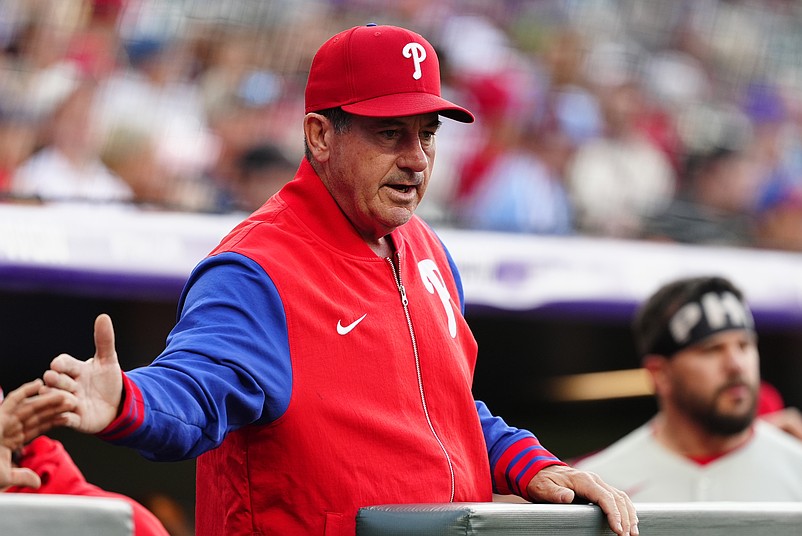 May 21, 2025; Denver, Colorado, USA; Philadelphia Phillies manager Rob Thomson (59) celebrates a run scored in the first inning against the Colorado Rockies at Coors Field. Mandatory Credit: Ron Chenoy-Imagn Images