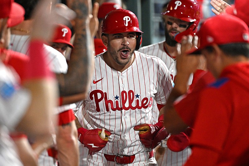 Sep 23, 2025; Philadelphia, Pennsylvania, USA; Philadelphia Phillies first base Otto Kemp (4) celebrates his two-run home run in the dugout during the second inning against the Miami Marlins at Citizens Bank Park. Mandatory Credit: Eric Hartline-Imagn Images