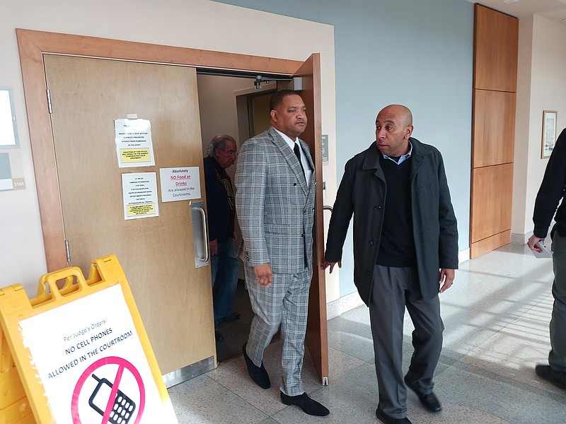 Atlantic City Mayor Marty Small, left, leaves the courtroom during a break in the trial.