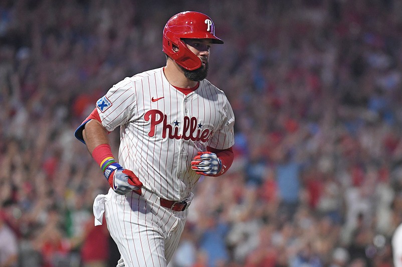 Aug 4, 2025; Philadelphia, Pennsylvania, USA; Philadelphia Phillies outfielder Kyle Schwarber (12) watches his grand slam home run during the sixth inning against the Baltimore Orioles at Citizens Bank Park. Mandatory Credit: Eric Hartline-Imagn Images