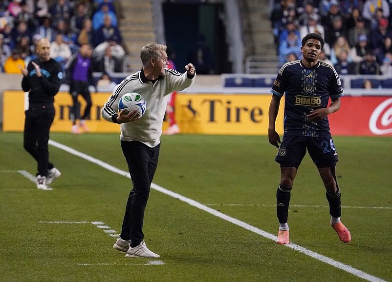 Union head coach Bradley Carnell, center, gestures to players next to Union defender Nathan Harriel in an Oct. 26 playoff game against the Chicago Fire at Subaru Park. Mandatory Credit: James Lang-Imagn Images