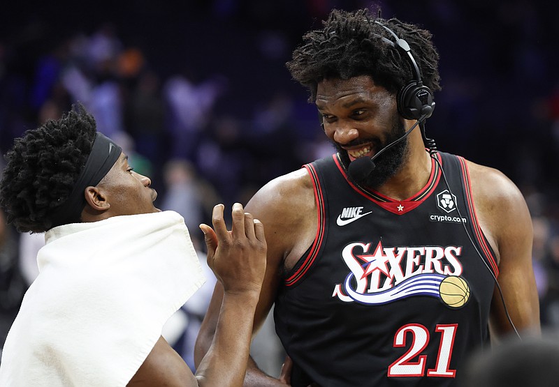 Dec 12, 2025; Philadelphia, Pennsylvania, USA; Philadelphia 76ers center Joel Embiid (21) reacts with Vj Edgecombe (L) after a win against the Indiana Pacers at Xfinity Mobile Arena. Mandatory Credit: Bill Streicher-Imagn Images