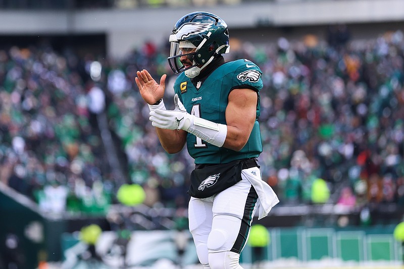 Dec 14, 2025; Philadelphia, Pennsylvania, USA; Philadelphia Eagles quarterback Jalen Hurts (1) reacts after running back Saquon Barkley (26) (not pictured) scores a touchdown against the Las Vegas Raiders during the second quarter at Lincoln Financial Field. Mandatory Credit: Bill Streicher-Imagn Images