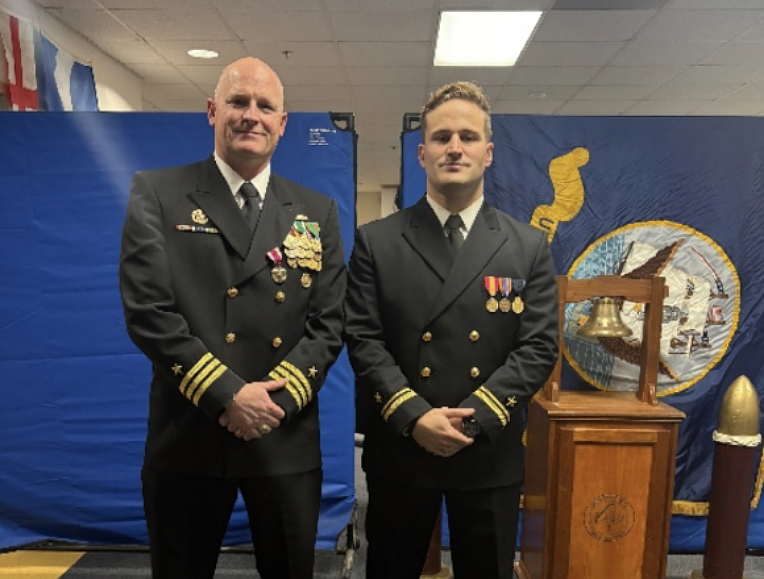 Rik Hayes (right), a 2015 Pennridge graduate, currently serves as a cryptologic warfare officer in signals intelligence. (Courtesy of the Navy Office of Community Outreach)