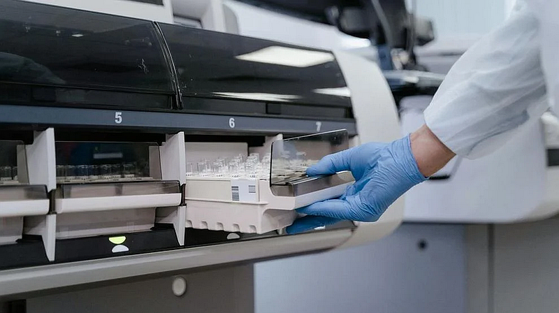 A lab technician processes blood test samples in a laboratory. Credit: Tima Miroshnichenko / Pexels