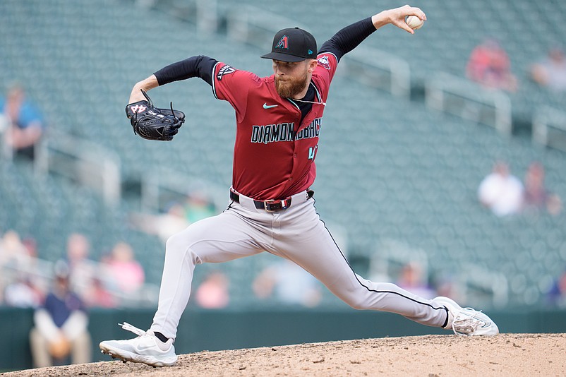 Sep 14, 2025; Minneapolis, Minnesota, USA; Arizona Diamondbacks pitcher Kyle Backhus (43) pitches to Minnesota Twins first base Kody Clemens (18) in the ninth inning at Target Field. Mandatory Credit: Matt Blewett-Imagn Images