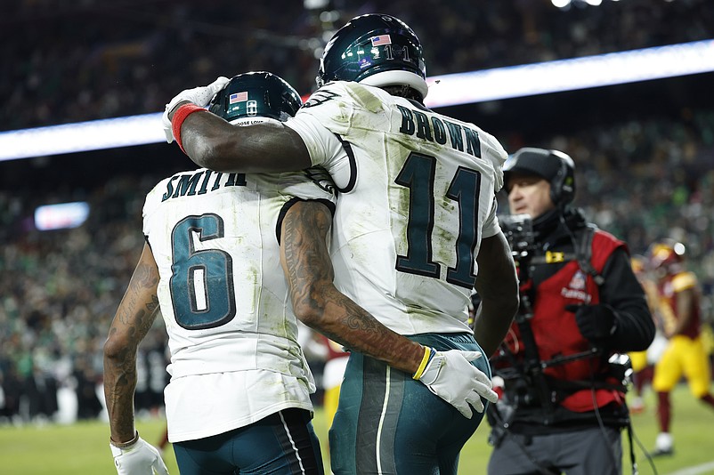 Dec 20, 2025; Landover, Maryland, USA; Philadelphia Eagles wide receiver Devonta Smith (6) celebrates with wide receiver A.J. Brown (11) after making a catch for a touchdown against the Washington Commanders in the first half at Northwest Stadium. Mandatory Credit: Geoff Burke-Imagn Images
