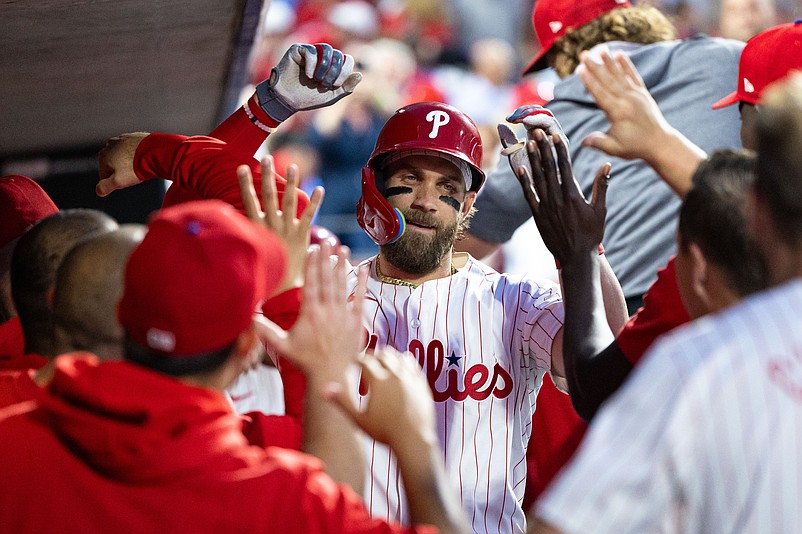 May 7, 2024; Philadelphia, Pennsylvania, USA; Philadelphia Phillies first base Bryce Harper (3) celebrates in the dugout after hitting a Gand Slam home run during the fourth inning against the Toronto Blue Jays at Citizens Bank Park. Mandatory Credit: Bill Streicher-USA TODAY Sports