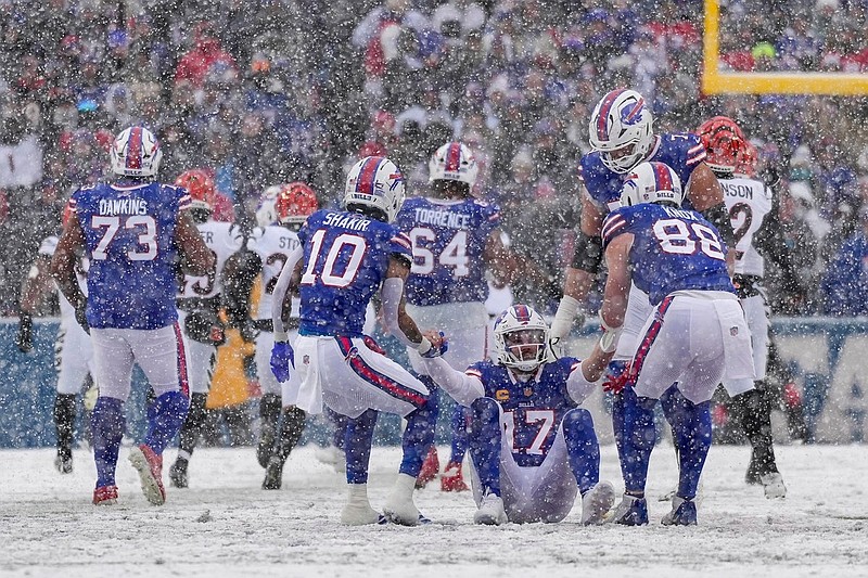 Buffalo Bills quarterback Josh Allen (17) is pulled to his feet after a play in the second quarter of the NFL Week 14 game between the Buffalo Bills and the Cincinnati Bengals at Highmark Stadium in Orchard Park, N.Y., on Sunday, Dec. 7, 2025.