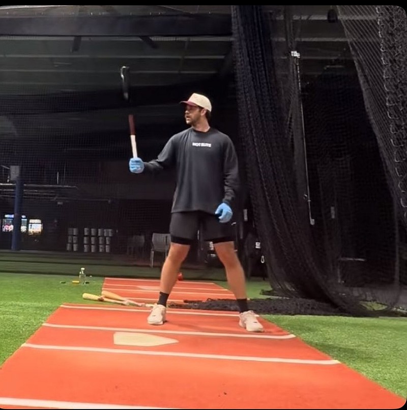 Bryce Harper working out in December, 2025 in a batting cage wearing a shirt that reads "Not Elite." (Screenshot from Harper's TikTok account.)