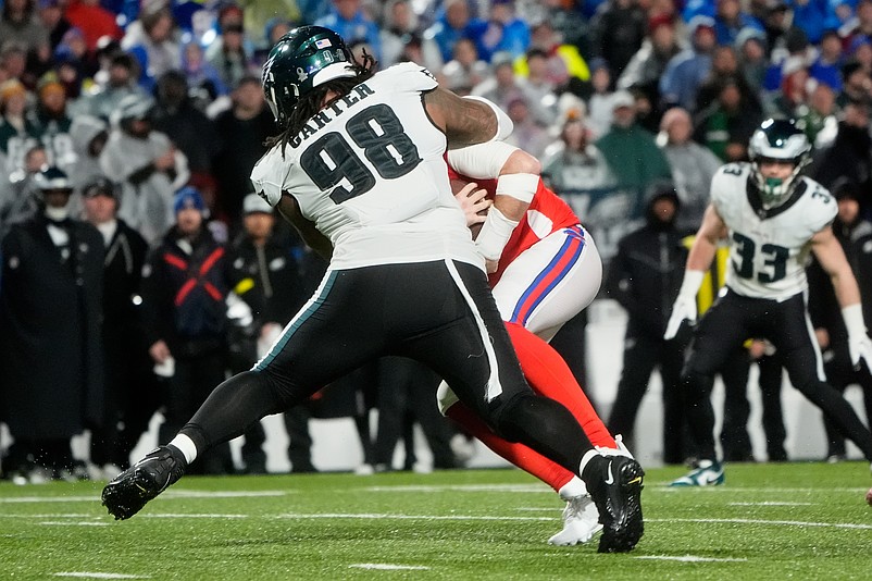 Dec 28, 2025; Orchard Park, New York, USA; Philadelphia Eagles defensive tackle Jalen Carter (98) sacks Buffalo Bills quarterback Josh Allen (17) during the second quarter at Highmark Stadium. Mandatory Credit: Gregory Fisher-Imagn Images
