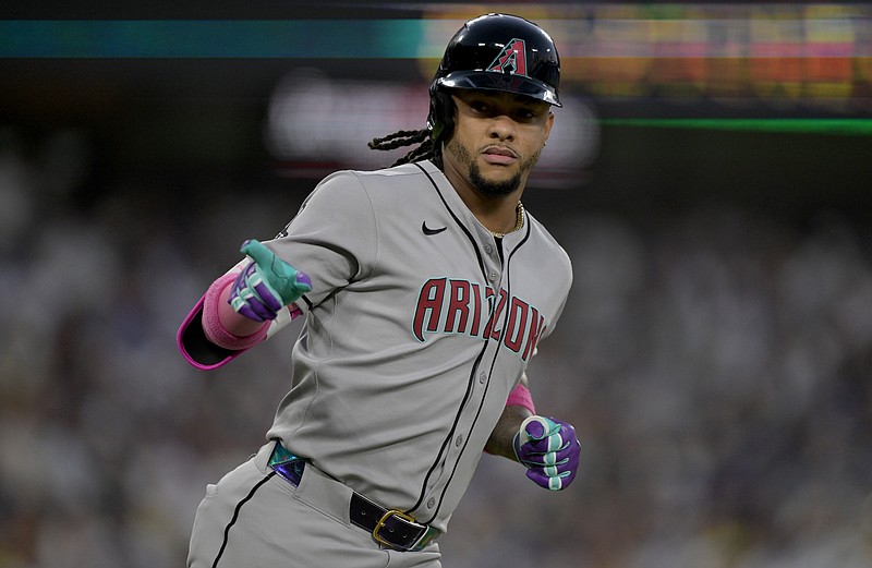 May 21, 2025; Los Angeles, California, USA; Arizona Diamondbacks second baseman Ketel Marte (4) reacts after hitting a home run during the fourth inning against the Los Angeles Dodgers at Dodger Stadium. Mandatory Credit: Jayne Kamin-Oncea-Imagn Images