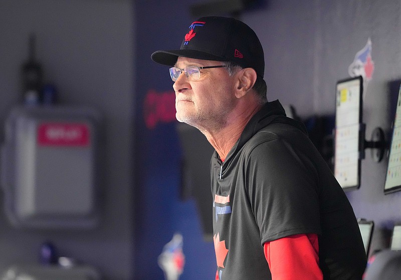Jun 3, 2024; Toronto, Ontario, CAN; Toronto Blue Jays bench coach & offensive coordinator Don Mattingly (23) looks out from the dugout prior to the start of a game against the Baltimore Orioles at Rogers Centre. Mandatory Credit: Nick Turchiaro-USA TODAY Sports