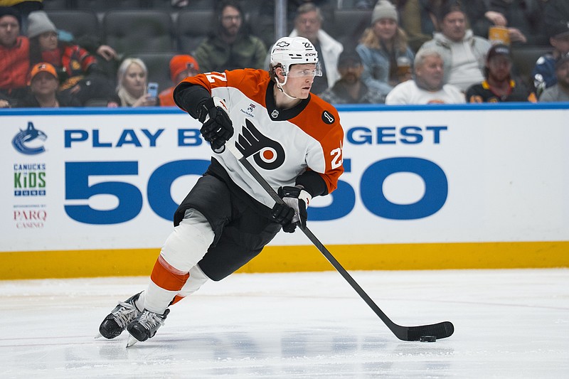 Dec 30, 2025; Vancouver, British Columbia, CAN; Philadelphia Flyers forward Christian Dvorak (22) handles the puck against the Vancouver Canucks in the second period at Rogers Arena. Mandatory Credit: Bob Frid-Imagn Images