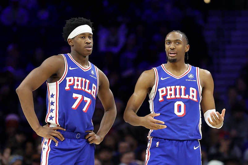 Jan 5, 2026; Philadelphia, Pennsylvania, USA; Philadelphia 76ers guard Tyrese Maxey (0) and guard Vj Edgecombe (77) talk during the second quarter against the Denver Nuggets at Xfinity Mobile Arena. Mandatory Credit: Bill Streicher-Imagn Images