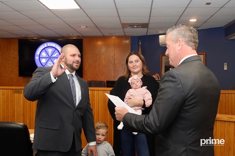 Accompanied by his family, Middle Township Committeeman James Norris, left, is sworn into a new term by CapeGOP Chairman and former Superior Court Judge Michael J. Donohue. (Photo courtesy of Prime Digital Marketing)