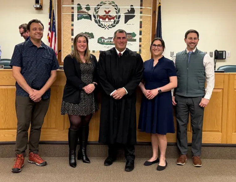 Newly elected and inaugurated Towamencin elected auditor Joe Rumsey, supervisors Courtney Morgan and Vanessa Gaynor, and tax collector Christian Fusco pose with District Judge Ed Levine, center, after swearing their oaths during a reorganization meeting on Monday, Jan. 5, 2026. (Photo courtesy of Towamencin Township)