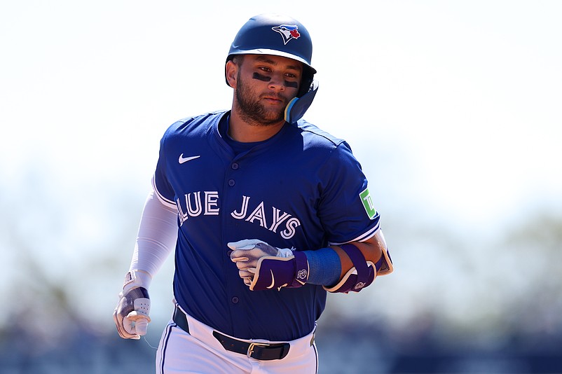 Mar 17, 2025; Dunedin, Florida, USA; Toronto Blue Jays shortstop Bo Bichette (11) runs the bases after hitting a home run against the New York Yankees in the second inning during spring training at TD Ballpark. Mandatory Credit: Nathan Ray Seebeck-Imagn Images