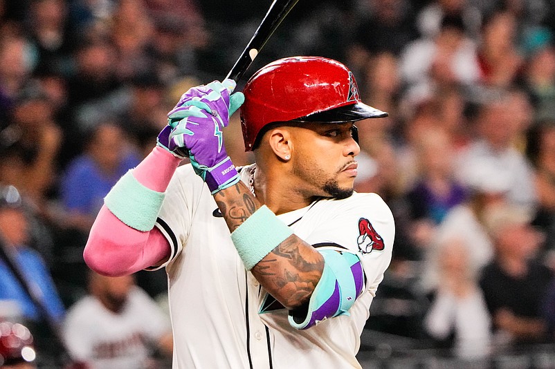 Sep 1, 2025; Phoenix, Arizona, USA;  Arizona Diamondbacks second base Ketel Marte (4) at bat in the first inning during the game between the Texas Rangers and Arizona Diamondbacks at Chase Field. Mandatory Credit: Arianna Grainey-Imagn Images