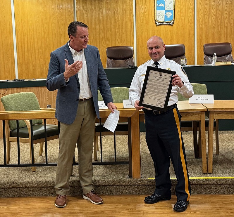 Longport Mayor Patrick Armstrong presents Frank Culmone with a proclamation upon his retirement as chief of the Longport Police Department, Jan. 15, 2026.