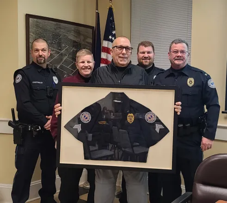 Retiring North Wales police Officer Terry Hammerstone, center, poses with fellow officers Jamie Johnstonbaugh, Lynne Custer, Pat O’Connor, and Chief Dave Erenius after being honored for nearly 27 years with the department on Tuesday, Jan. 13, 2026.
