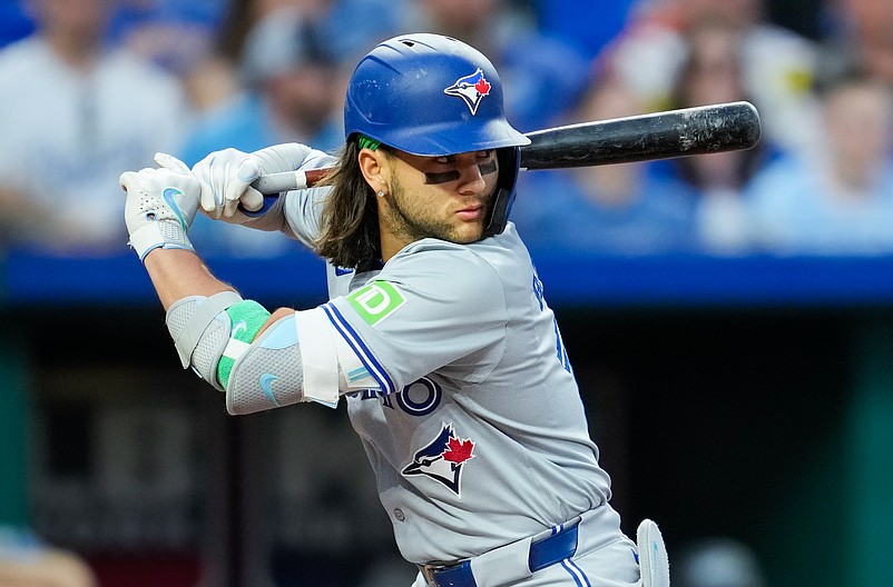 Apr 24, 2024; Kansas City, Missouri, USA; Toronto Blue Jays shortstop Bo Bichette (11) bats during the fifth inning against the Kansas City Royals at Kauffman Stadium. Mandatory Credit: Jay Biggerstaff-USA TODAY Sports