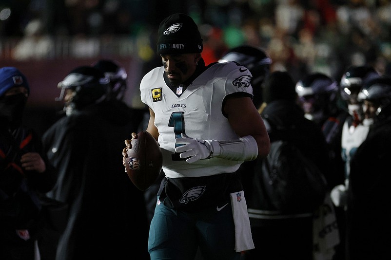 Dec 20, 2025; Landover, Maryland, USA; Philadelphia Eagles quarterback Jalen Hurts (1) looks on from the sidelines during a stoppage in play against the Washington Commanders in the second half at Northwest Stadium. Mandatory Credit: Amber Searls-Imagn Images