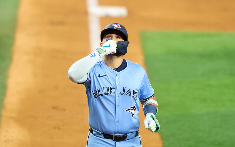 May 28, 2025; Arlington, Texas, USA; Toronto Blue Jays shortstop Bo Bichette (11) reacts after hitting a two-run home run during the ninth inning against the Texas Rangers at Globe Life Field. Mandatory Credit: Kevin Jairaj-Imagn Images