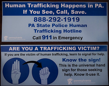 Signs created by the state government to help fight human trafficking. File photo.